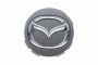 Заглушка колесного диска центральная Mazda BK/GG - Оригинал - Мазда96 - интернет магазин запчастей